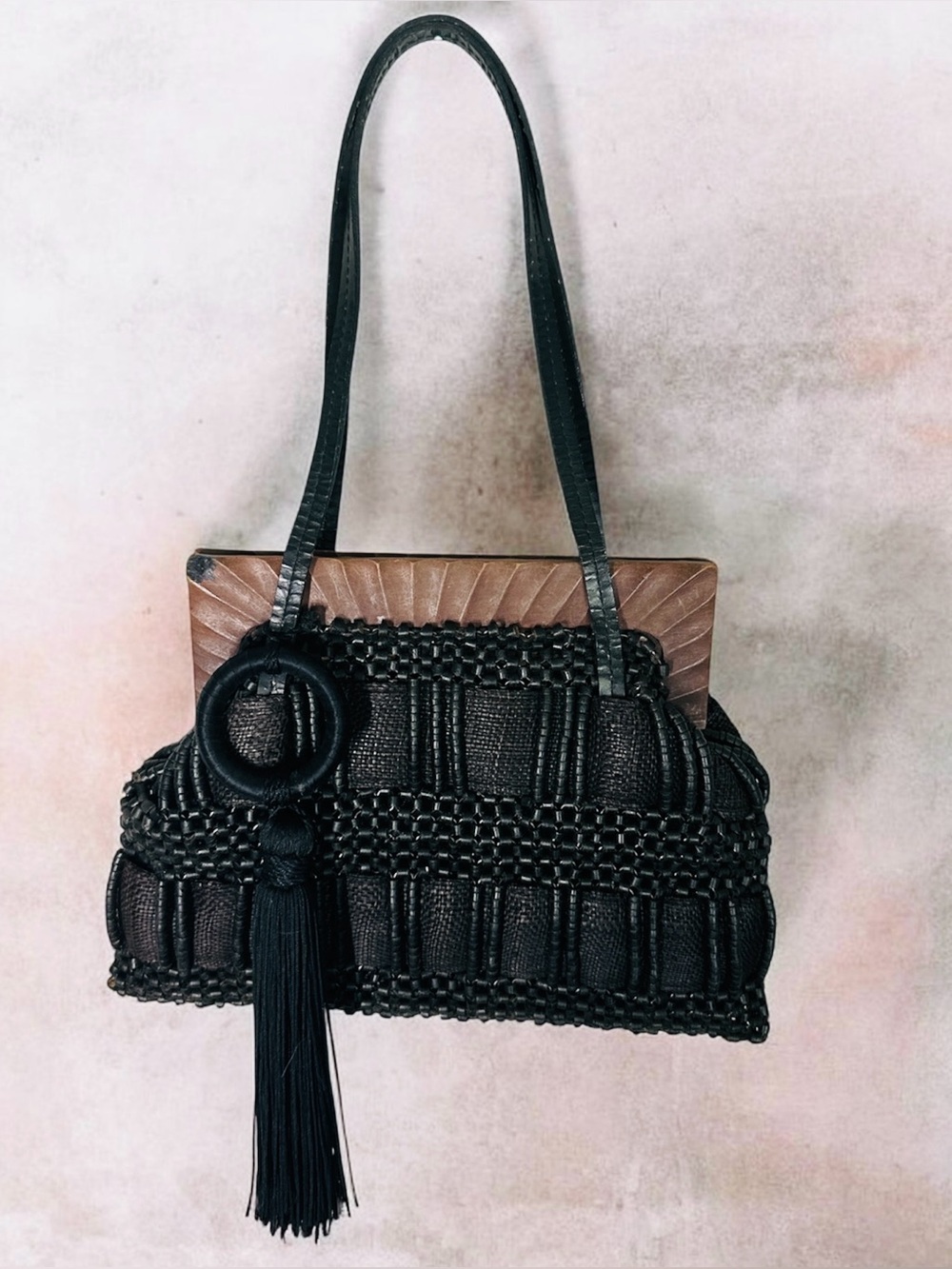 Aranaz Antik Batik tote features a wooden frame woven beaded detail and tassel